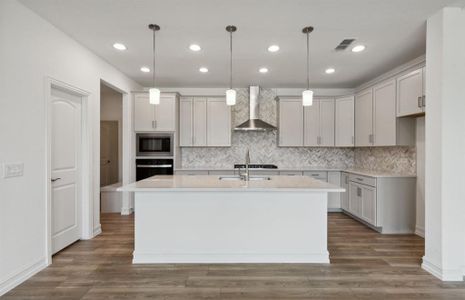 Bright kitchen with oversized island *real home pictured