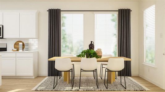 Dining space with light hardwood / wood-style floors