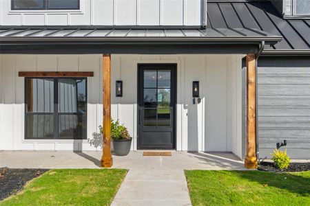 Entrance to property with covered porch