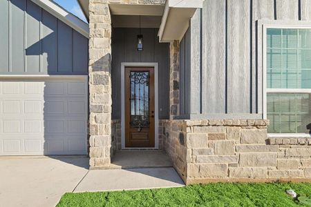 Doorway to property featuring a garage