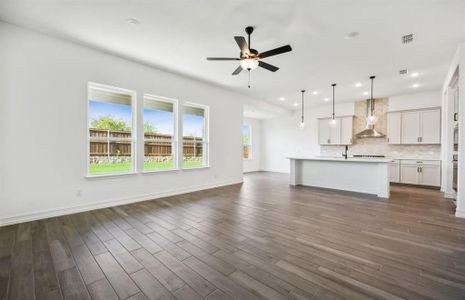 Airy gathering room with large windows *real home pictured