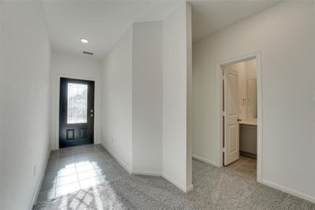 View of carpeted foyer