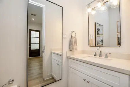 Half bath downstairs with neutral tones