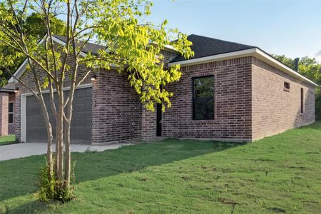 View of front facade with a garage and a front lawn