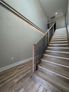 Stairway with hardwood / wood-style floors