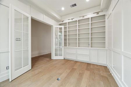 Another view of the Study which also features a set of divided lite French Doors.  There is also paneling on the South and West walls too.  Construction as of January 13, 2025.