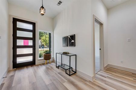 Entrance foyer featuring light LVL style flooring