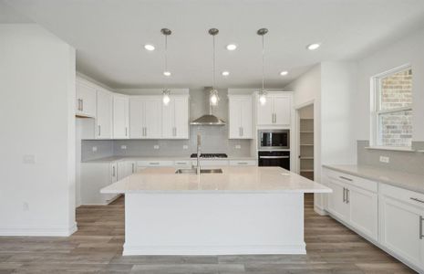 Airy kitchen with ample cabinet space *real home pictured