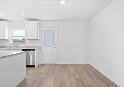 The dining room has access to the back yard.