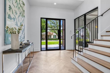 Doorway featuring light parquet floors