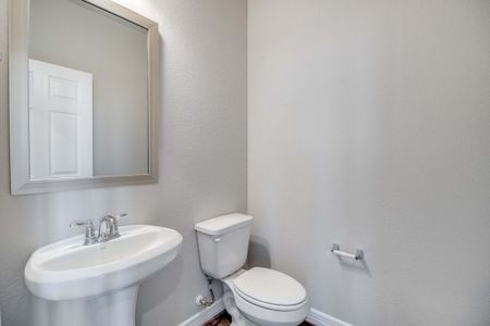 Powder room. Note: Sample product photo - actual exterior and interior selections may vary by homesite