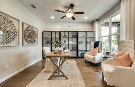 Flexible living space off entryway, shown as study