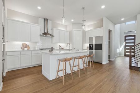 Kitchen in the Picasso II home plan by Trophy Signature Homes – REPRESENTATIVE PHOTO