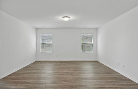 Airy gathering room with large windows *real home pictured