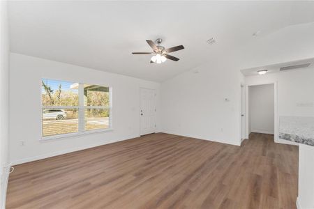 Large living area with ceiling fan