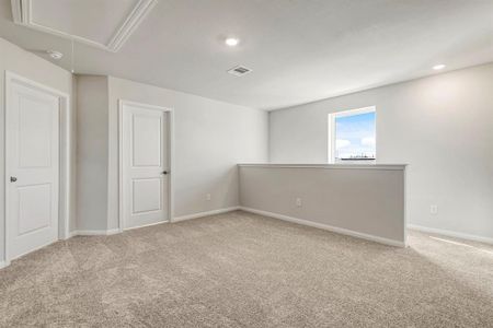 The area at the top of the stairs can be utilized for a media or game room!