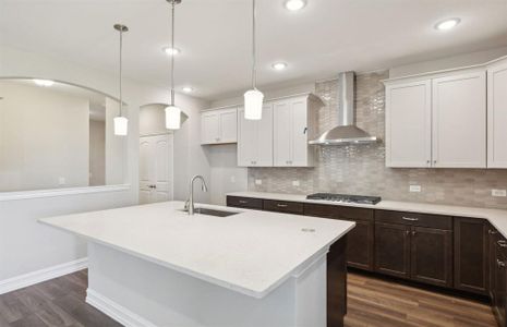 Spacious kitchen with oversized island *real home pictured