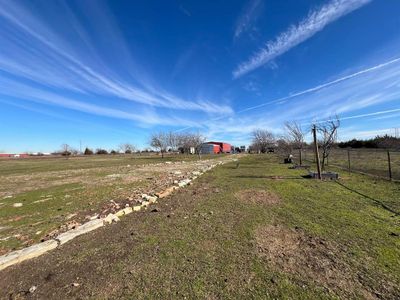 View of yard with a rural view