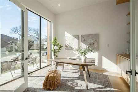 Office area with light hardwood / wood-style floors