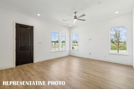 Our end unit Martin plan offers a multiple walls of windows to flood the home with natural light.  REPRESENTATIVE PHOTO