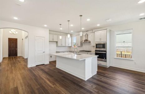 Bright kitchen with oversized island  *real home pictured