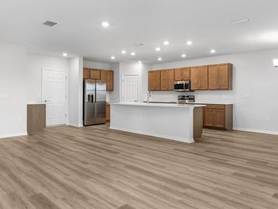 Enjoy a sunny, open living area finished with luxury vinyl plank flooring.