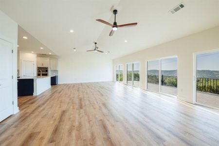 Living area, looks out to balcony and Hill Country view