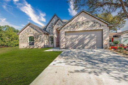 Exterior of home with front facing garage.