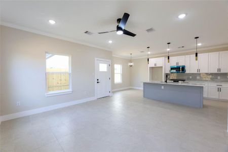 As you walk in, a long hallway leads you to the Family Room, Kitchen & Dining Area. All bedrooms up which makes the 1st floor great for entertaining! Tile on 1st floor, large island w/ quartz counters & stainless steel appliances. Plenty of natural light throughout.