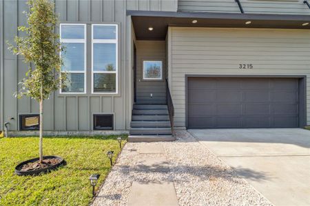 This walkway embodies attention to detail with landscaping, concrete pavers surrounded by Flagstone.