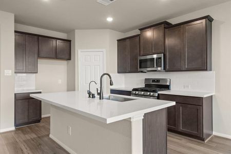 This kitchen is not only a functional space but also has ample storage. Whether you're a seasoned chef or just love to gather and enjoy good food, this kitchen is a dream come true.