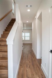 Corridor featuring hardwood / wood-style floors