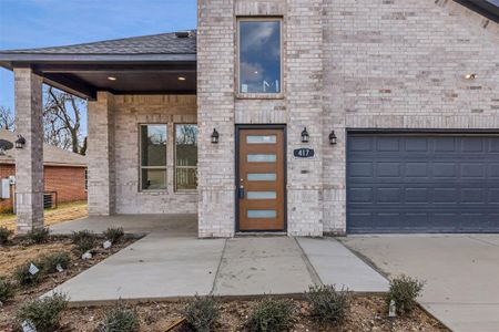 View of exterior entry featuring a garage