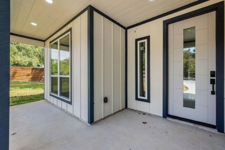 The covered front porch would be a nice spot for a chair to relax out of the sun