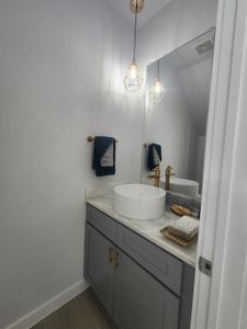 Bathroom featuring hardwood / wood-style floors and vanity