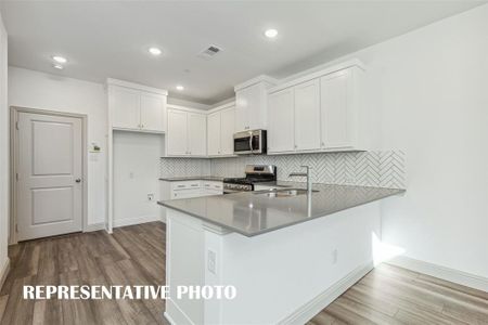 Crisp and clean with plenty of space, the kitchen in our Conrad plan would make any chef proud to call this home!  REPRESENTATIVE PHOTO