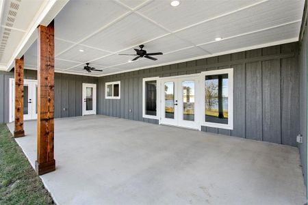 View of patio featuring ceiling fan and french doors