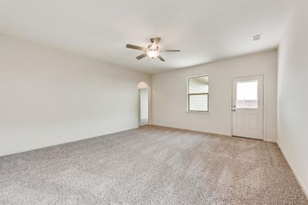 Living room featuring ceiling fan and light colored carpet