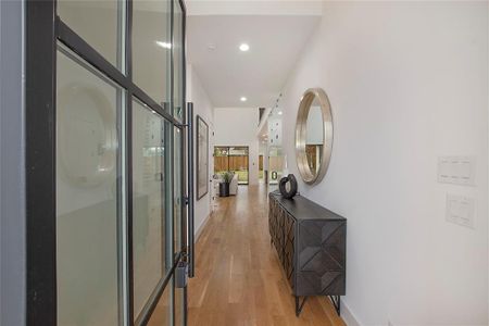 Hallway with light wood-type flooring