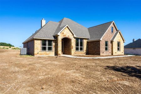 View of front of property with central AC unit