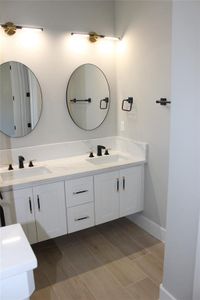 Bathroom featuring vanity and hardwood / wood-style flooring