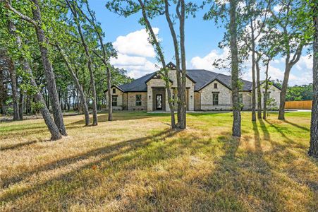 French country style house with a front yard