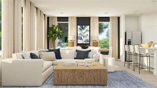 Living room featuring a wealth of natural light and light hardwood / wood-style flooring