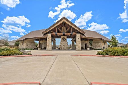 A scenic overlook greets visitors as soon as they drive in, revealing a lakeside view that gives way to an open-air pavilion and amenity center.