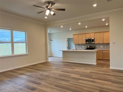 Large Living Room  with crown molding; Open to Kitchen and Dining