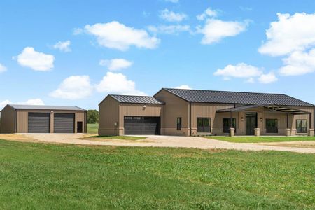 Contemporary house with a garage and a front lawn