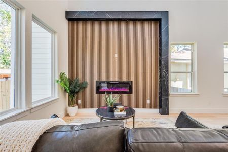 Living room featuring plenty of natural light and hardwood / wood-style floors