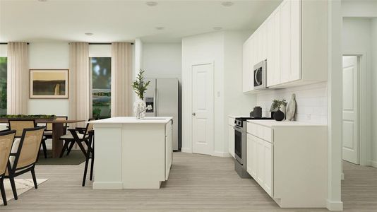 Kitchen featuring stainless steel appliances, tasteful backsplash, a breakfast bar area, a kitchen island with sink, and white cabinets