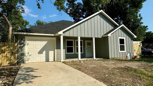 View of front of house with a garage and covered porch