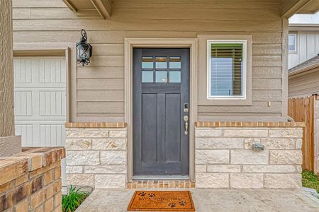 The front door features a traditional deadbolt key lock as well as an electronic keypad for entry.